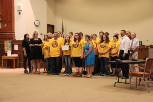 DNA Robotics Team accepting a Certificate of Recognition from the ISD 709 School Board